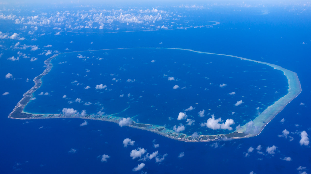Aerial view of a coral atoll in French Polynesia in the South Pacific Ocean.